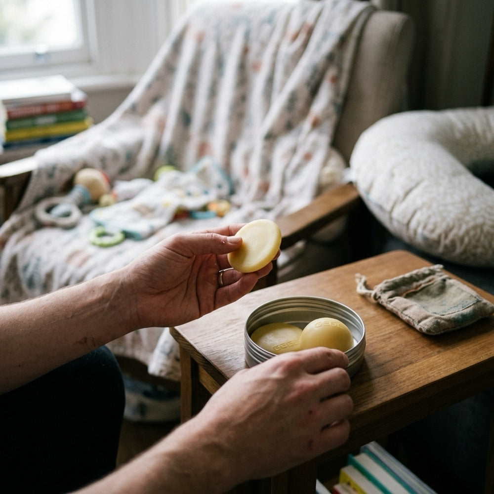 Hand holding a BOOBEES beeswax disc